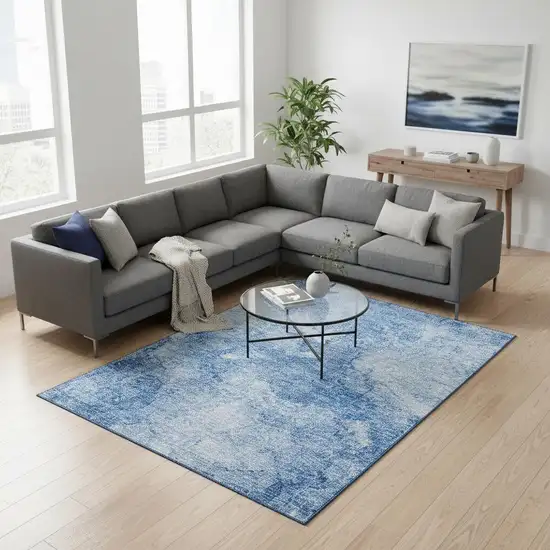 Blue And Ivory Abstract Washable Area Rug With UV Protection Photo 1