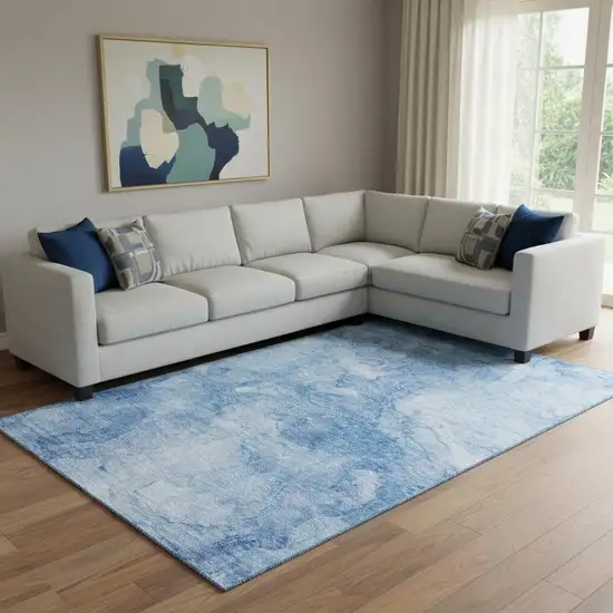 Blue And Ivory Abstract Washable Area Rug With UV Protection Photo 1