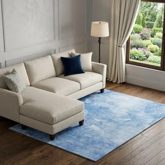 Blue And Ivory Abstract Washable Area Rug With UV Protection Photo 1