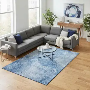 Photo of Blue And Ivory Abstract Washable Area Rug With UV Protection