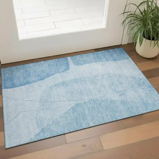 Blue And Ivory Abstract Washable Area Rug With UV Protection Photo 1