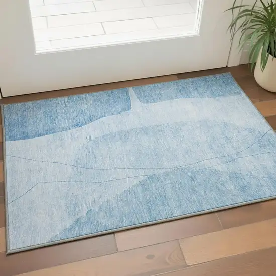Blue And Ivory Abstract Washable Area Rug With UV Protection Photo 3