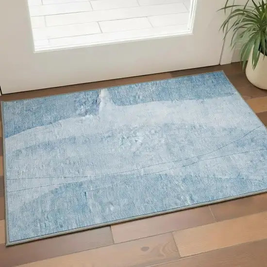 Blue And Ivory Abstract Washable Area Rug With UV Protection Photo 2