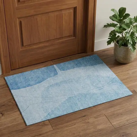 Blue And Ivory Abstract Washable Area Rug With UV Protection Photo 1