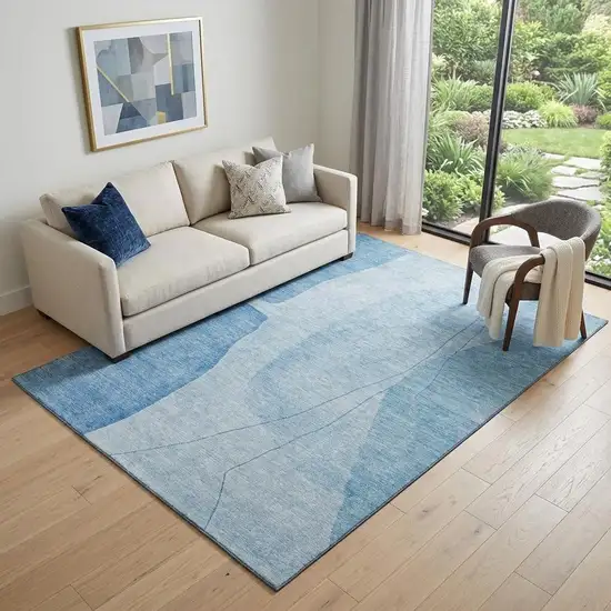 Blue And Ivory Abstract Washable Area Rug With UV Protection Photo 1