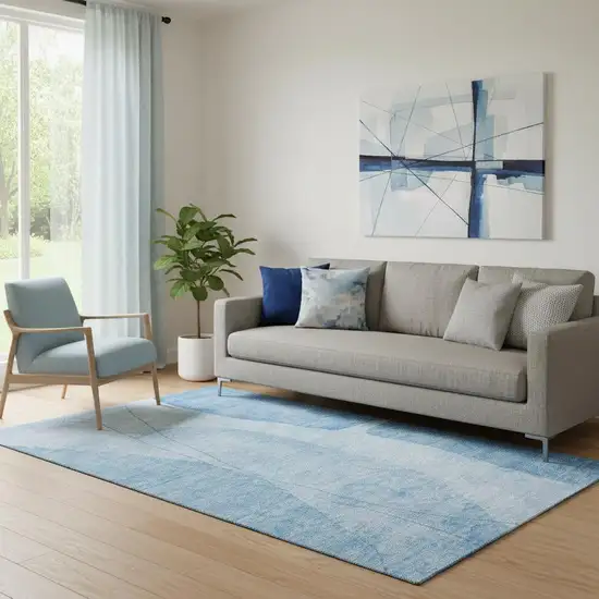 Blue And Ivory Abstract Washable Area Rug With UV Protection Photo 1