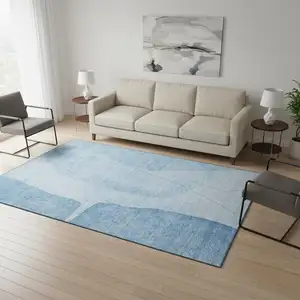Photo of Blue And Ivory Abstract Washable Area Rug With UV Protection