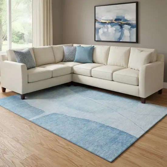 Blue And Ivory Abstract Washable Area Rug With UV Protection Photo 1
