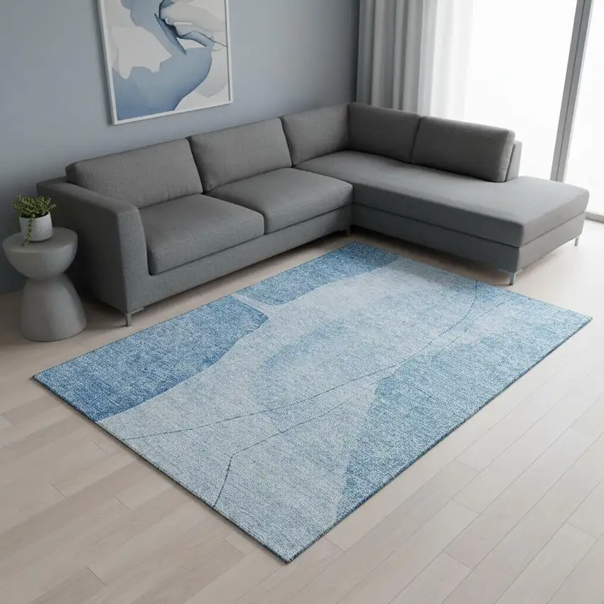 Blue And Ivory Abstract Washable Area Rug With UV Protection Photo 1