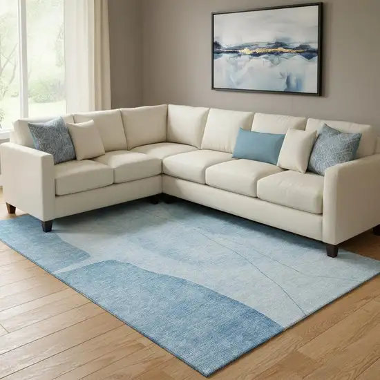 Blue And Ivory Abstract Washable Area Rug With UV Protection Photo 1