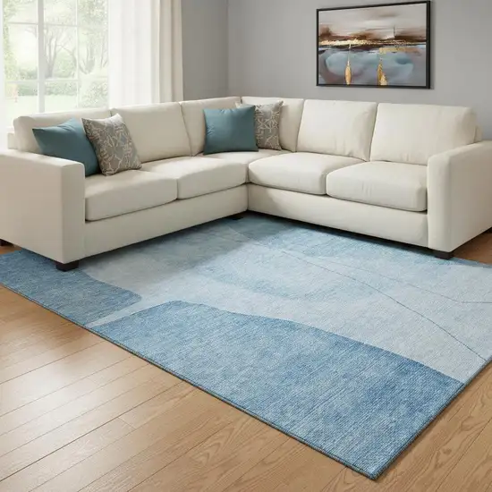 Blue And Ivory Abstract Washable Area Rug With UV Protection Photo 1