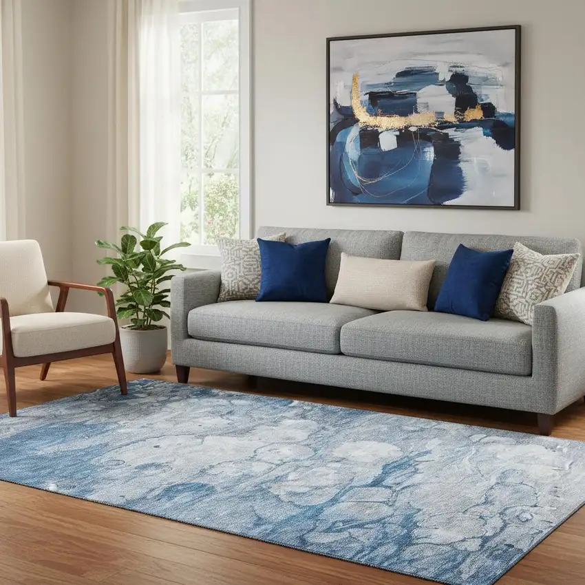 Blue And Ivory Abstract Washable Area Rug With UV Protection Photo 1