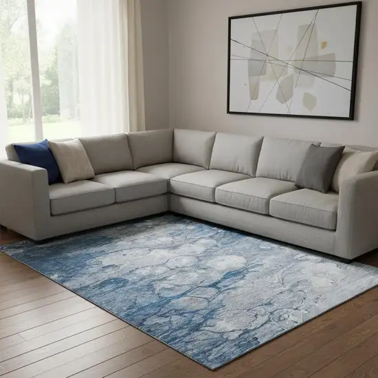 Blue And Ivory Abstract Washable Area Rug With UV Protection Photo 1