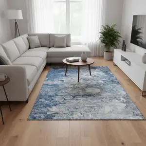 Photo of Blue And Ivory Abstract Washable Area Rug With UV Protection