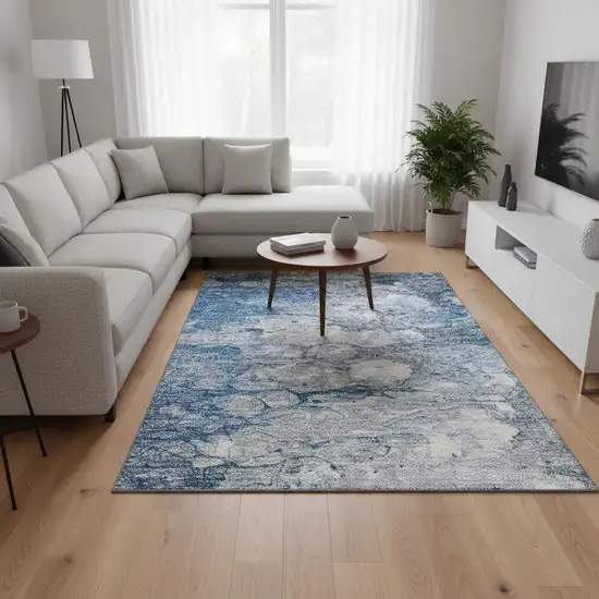 Blue And Ivory Abstract Washable Area Rug With UV Protection Photo 1