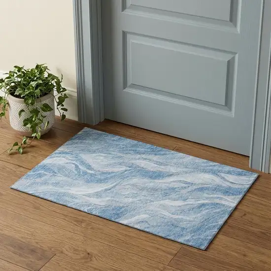Blue And Ivory Abstract Washable Area Rug With UV Protection Photo 1