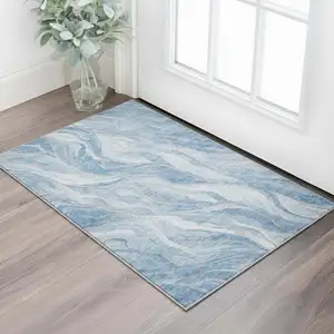 Photo of Blue And Ivory Abstract Washable Area Rug With UV Protection