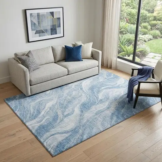 Blue And Ivory Abstract Washable Area Rug With UV Protection Photo 1