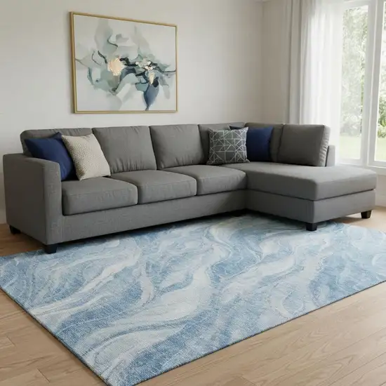Blue And Ivory Abstract Washable Area Rug With UV Protection Photo 1