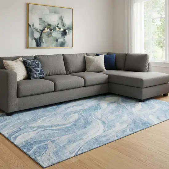 Blue And Ivory Abstract Washable Area Rug With UV Protection Photo 1