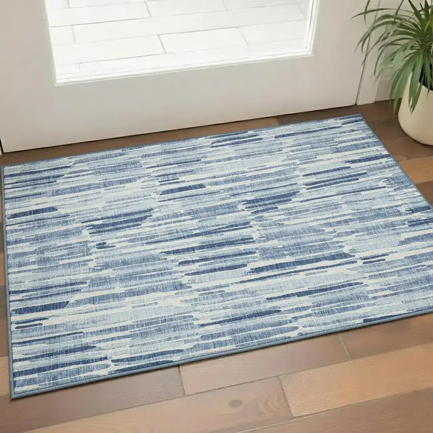Blue And Ivory Abstract Washable Area Rug With UV Protection Photo 1