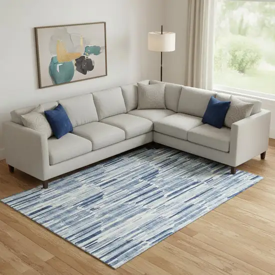 Blue And Ivory Abstract Washable Area Rug With UV Protection Photo 1