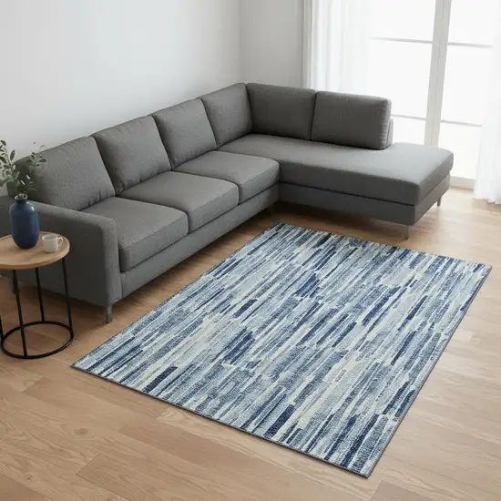 Blue And Ivory Abstract Washable Area Rug With UV Protection Photo 2