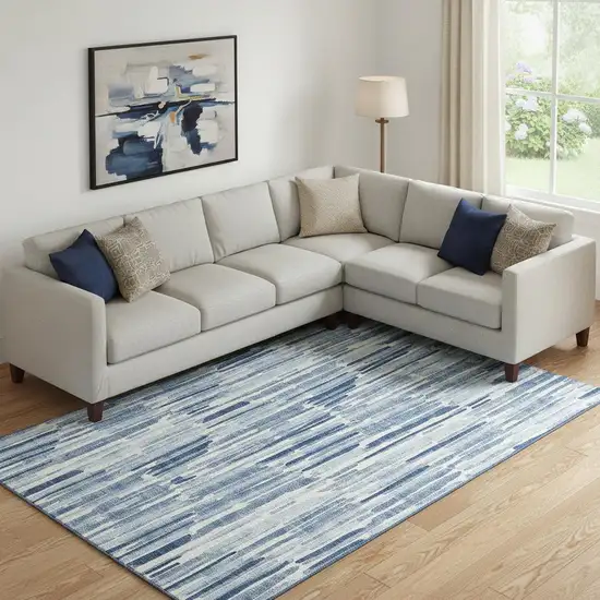 Blue And Ivory Abstract Washable Area Rug With UV Protection Photo 1