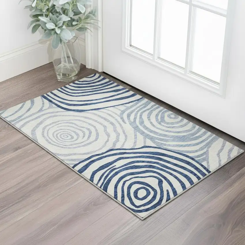 Blue And Ivory Abstract Washable Area Rug With UV Protection Photo 2