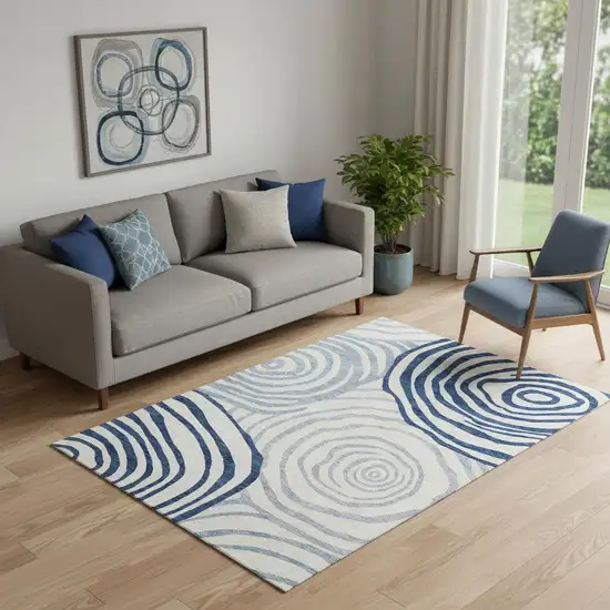 Blue And Ivory Abstract Washable Area Rug With UV Protection Photo 1