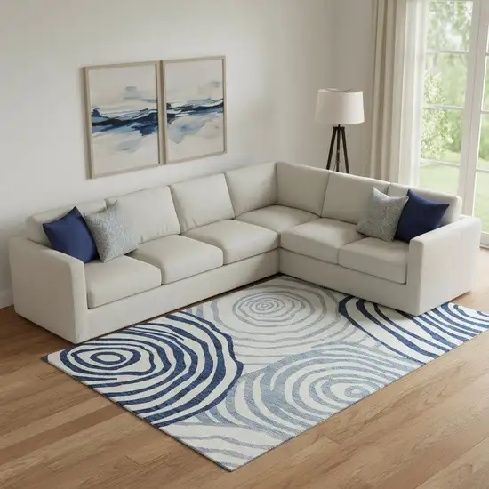 Blue And Ivory Abstract Washable Area Rug With UV Protection Photo 1