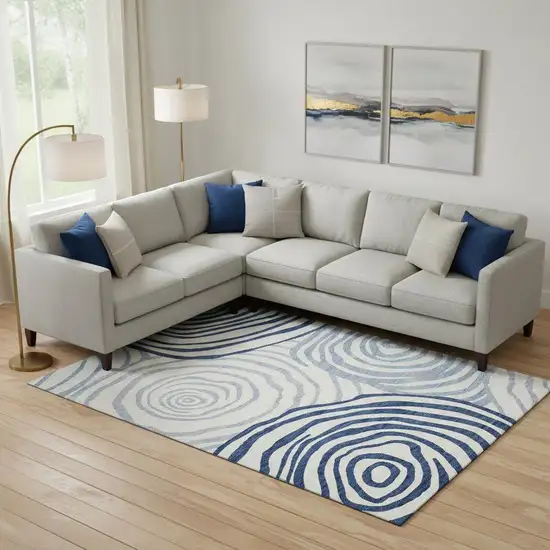 Blue And Ivory Abstract Washable Area Rug With UV Protection Photo 1