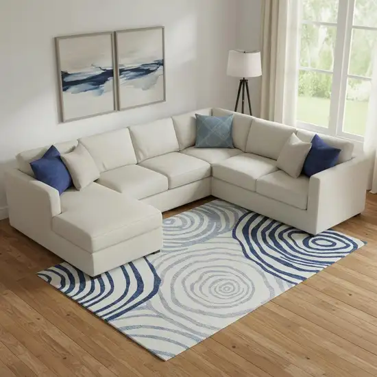 Blue And Ivory Abstract Washable Area Rug With UV Protection Photo 1