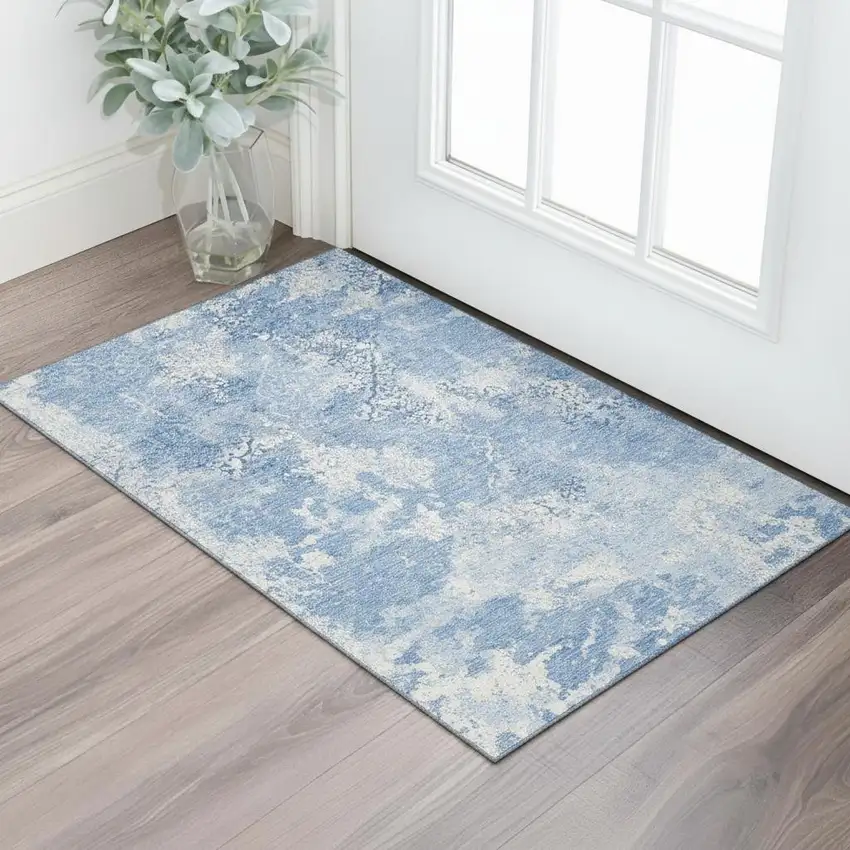 Blue And Ivory Abstract Washable Area Rug With UV Protection Photo 1
