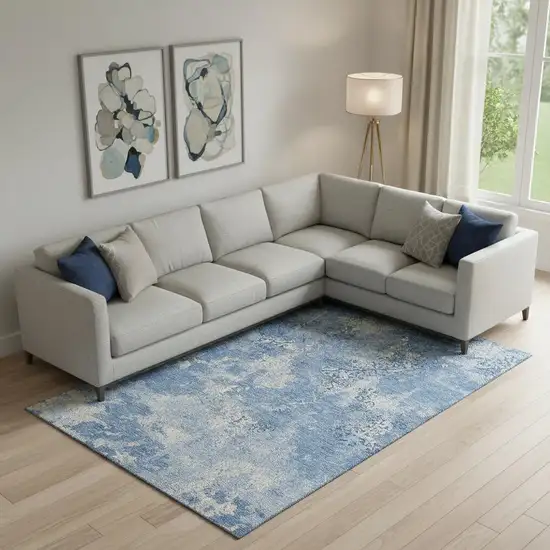 Blue And Ivory Abstract Washable Area Rug With UV Protection Photo 1