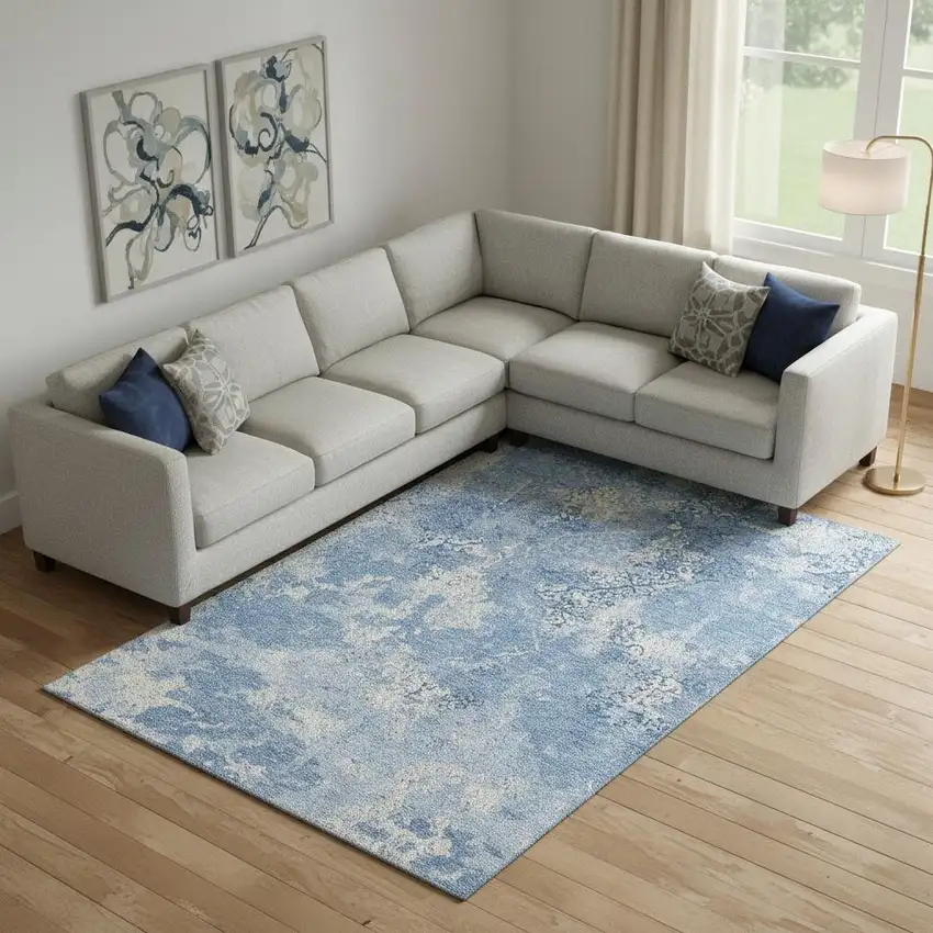 Blue And Ivory Abstract Washable Area Rug With UV Protection Photo 1