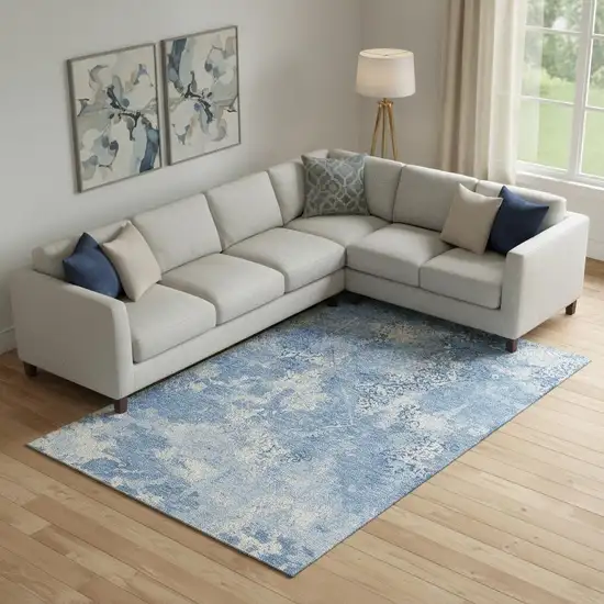 Blue And Ivory Abstract Washable Area Rug With UV Protection Photo 1