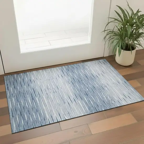 Blue And Ivory Abstract Washable Area Rug With UV Protection Photo 1