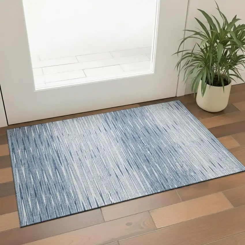Blue And Ivory Abstract Washable Area Rug With UV Protection Photo 1