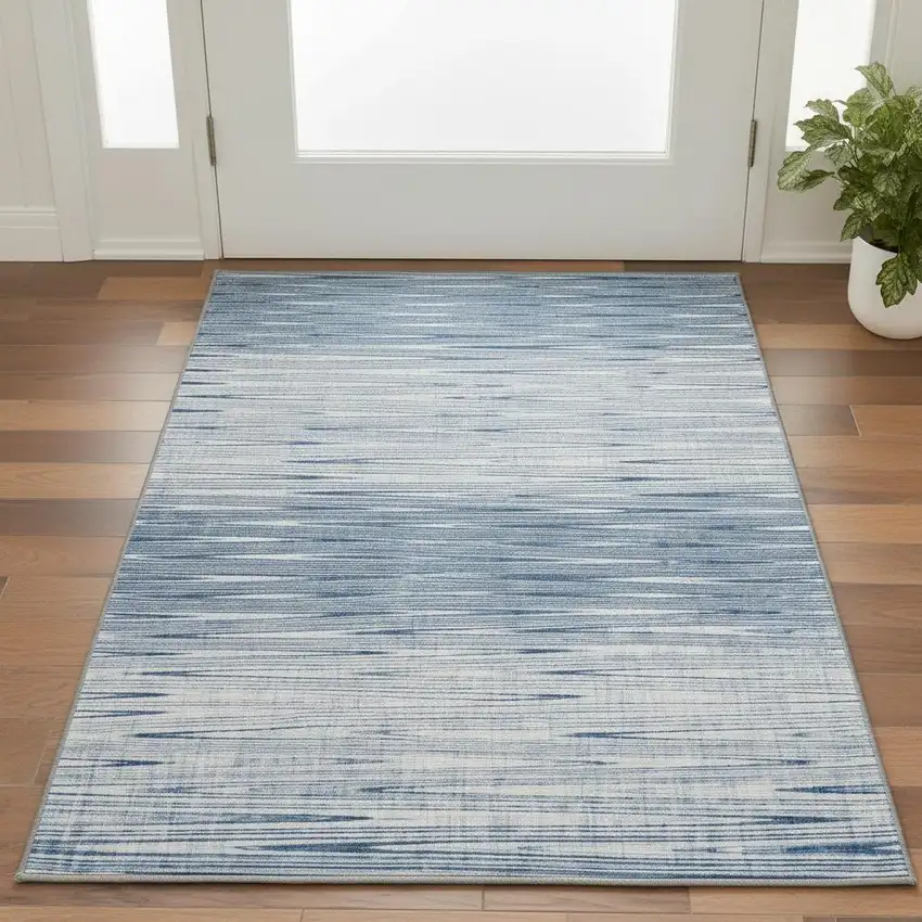 Blue And Ivory Abstract Washable Area Rug With UV Protection Photo 2