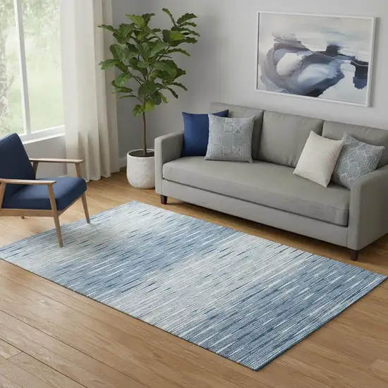 Blue And Ivory Abstract Washable Area Rug With UV Protection Photo 1