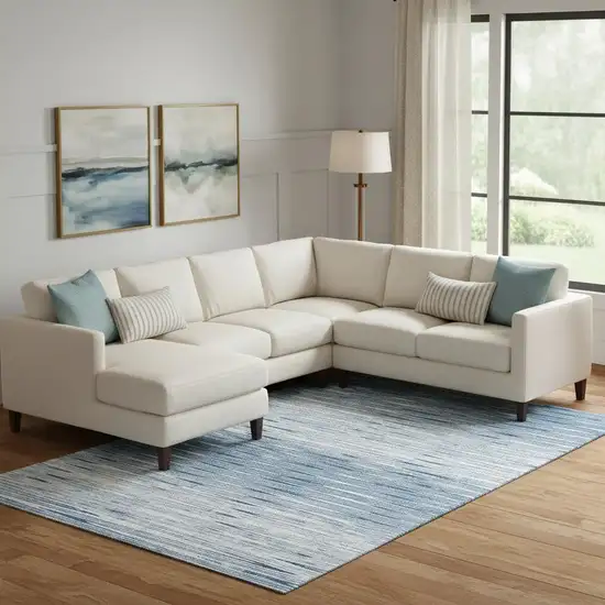 Blue And Ivory Abstract Washable Area Rug With UV Protection Photo 1