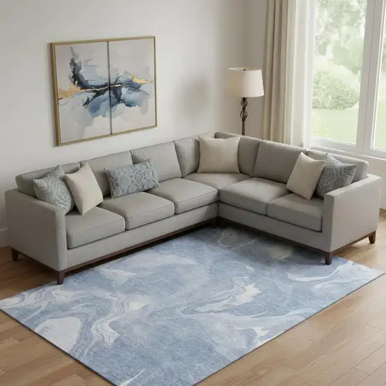 Blue And Ivory Abstract Washable Area Rug With UV Protection Photo 1