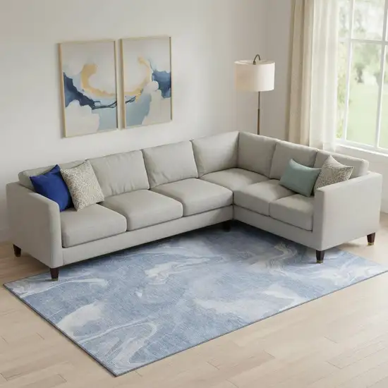 Blue And Ivory Abstract Washable Area Rug With UV Protection Photo 1