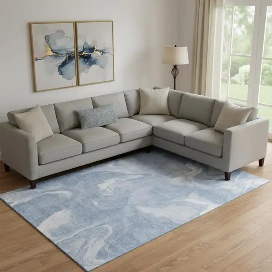 Blue And Ivory Abstract Washable Area Rug With UV Protection Photo 1