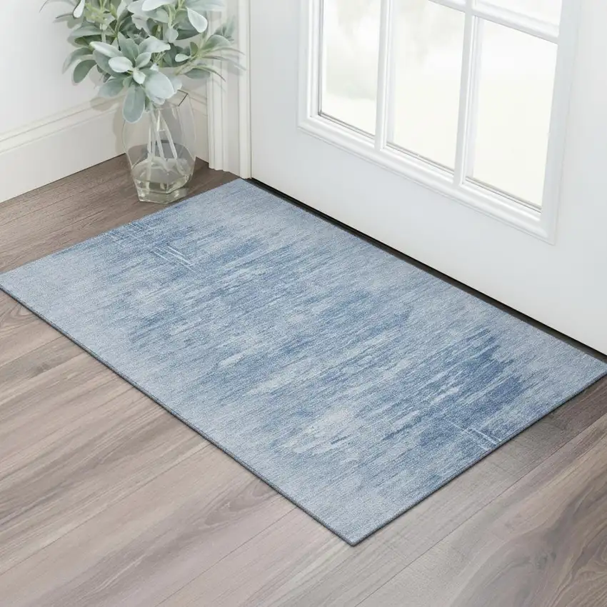 Blue And Ivory Abstract Washable Area Rug With UV Protection Photo 1