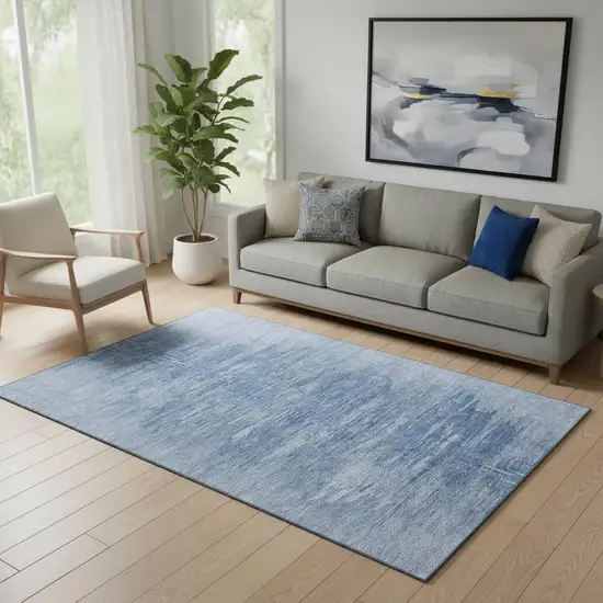 Blue And Ivory Abstract Washable Area Rug With UV Protection Photo 1