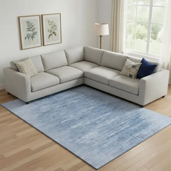 Blue And Ivory Abstract Washable Area Rug With UV Protection Photo 1