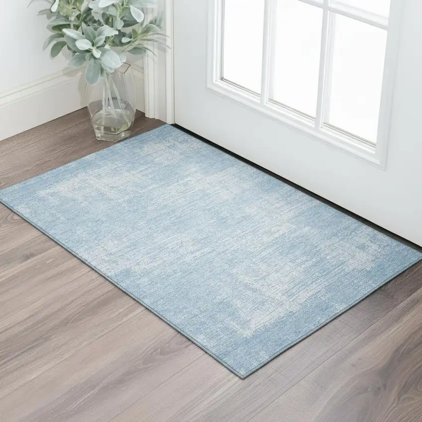 Blue And Ivory Abstract Washable Area Rug With UV Protection Photo 1