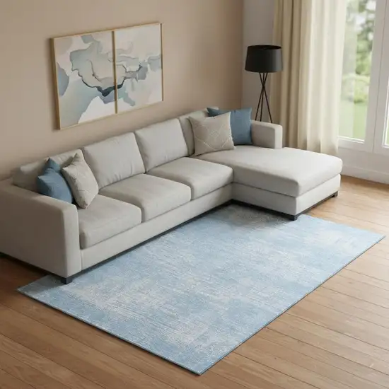 Blue And Ivory Abstract Washable Area Rug With UV Protection Photo 1
